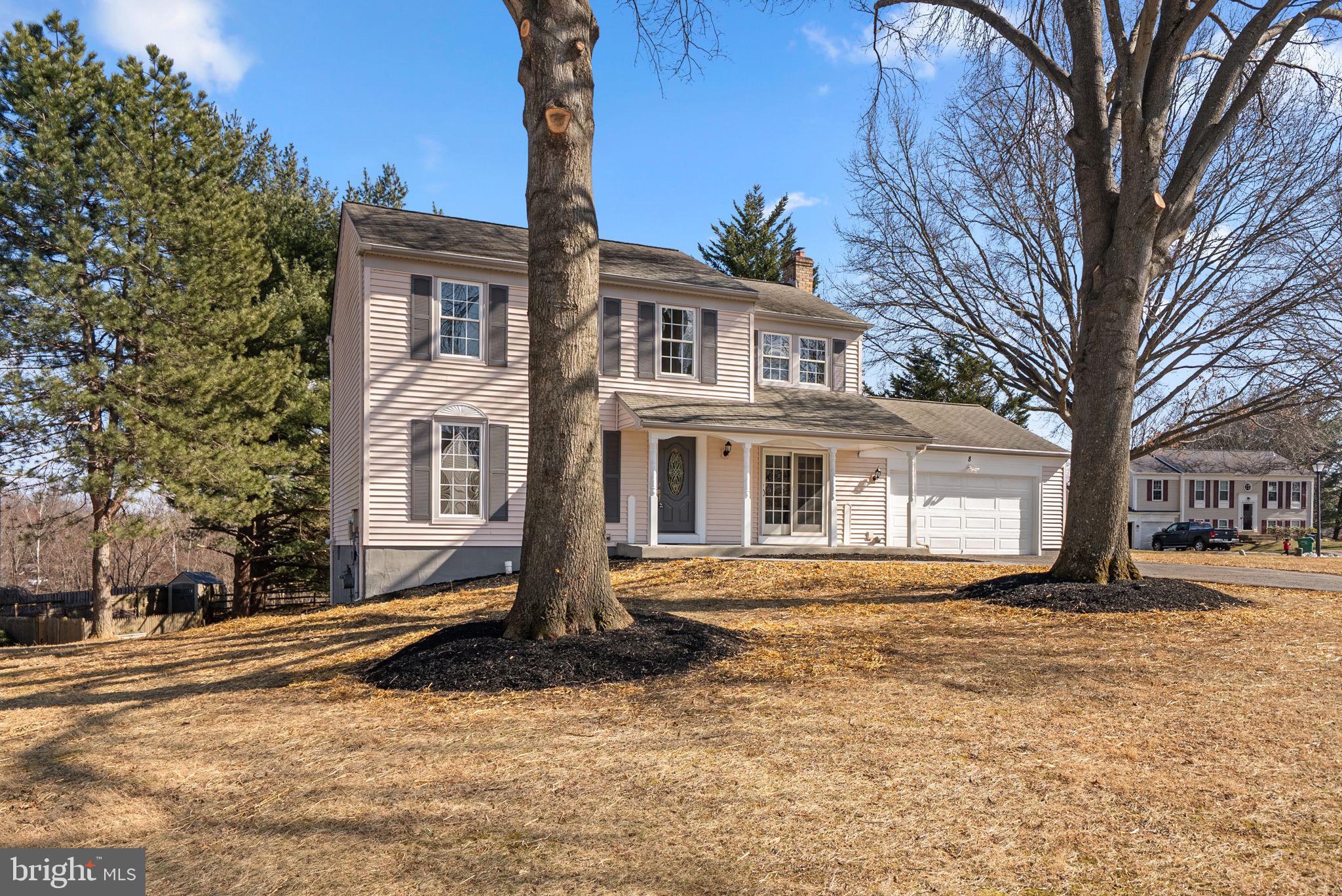 8 Seville Way Gaithersburg, MD 20878 - Photo 2 of 45 a front view of a house with a yard covered with snow