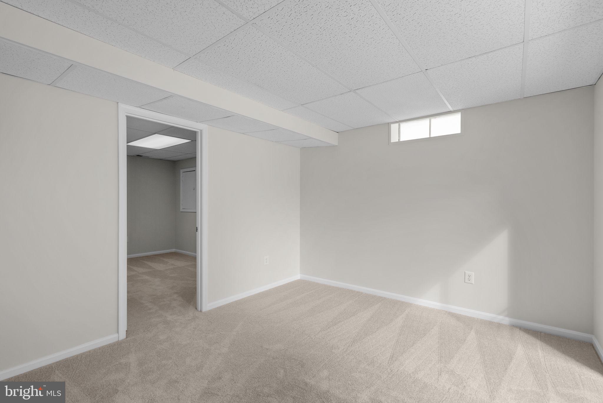 8 Seville Way Gaithersburg, MD 20878 - Photo 23 of 45 a view of an empty room and a window