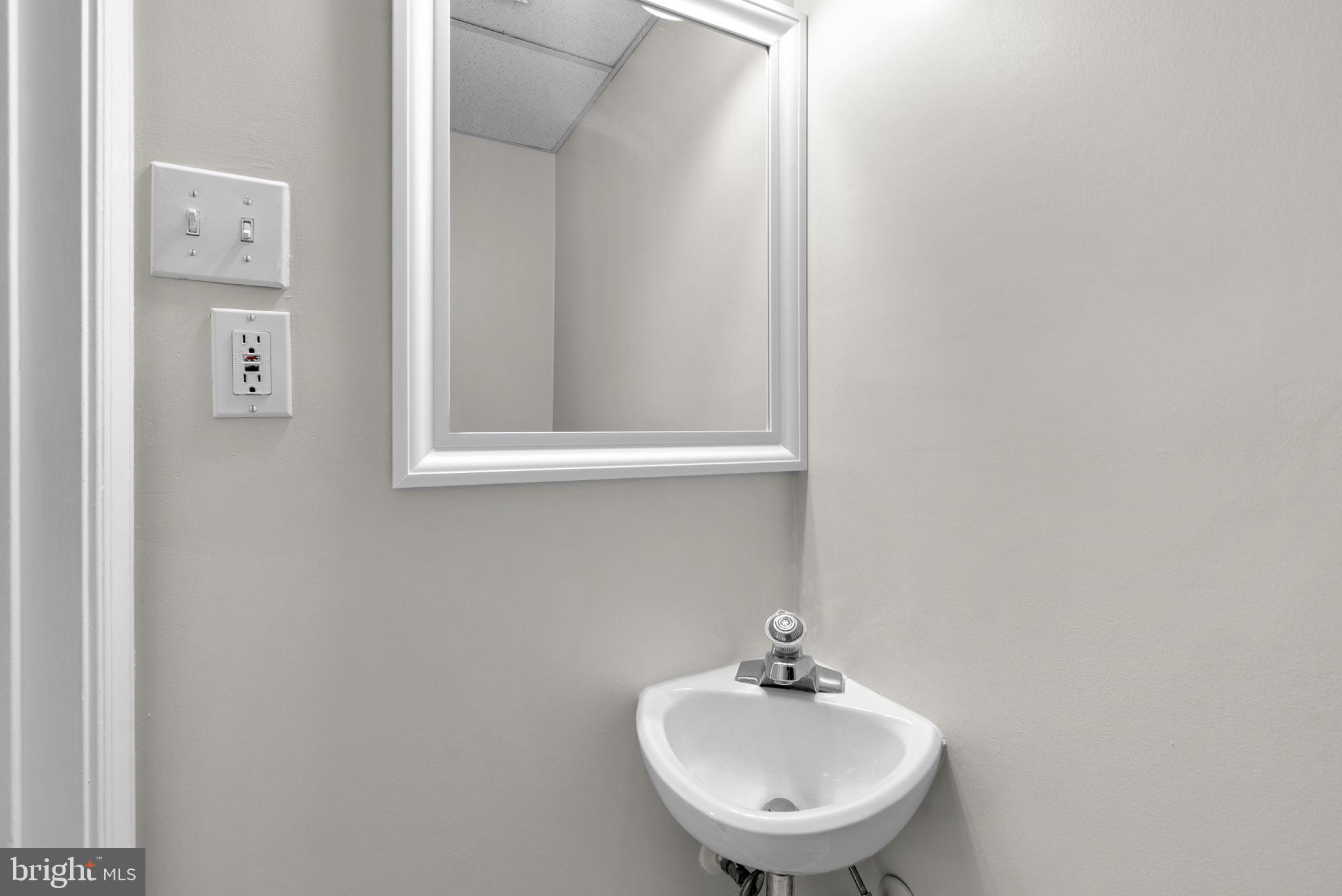 8 Seville Way Gaithersburg, MD 20878 - Photo 27 of 45 a bathroom with a sink and a mirror