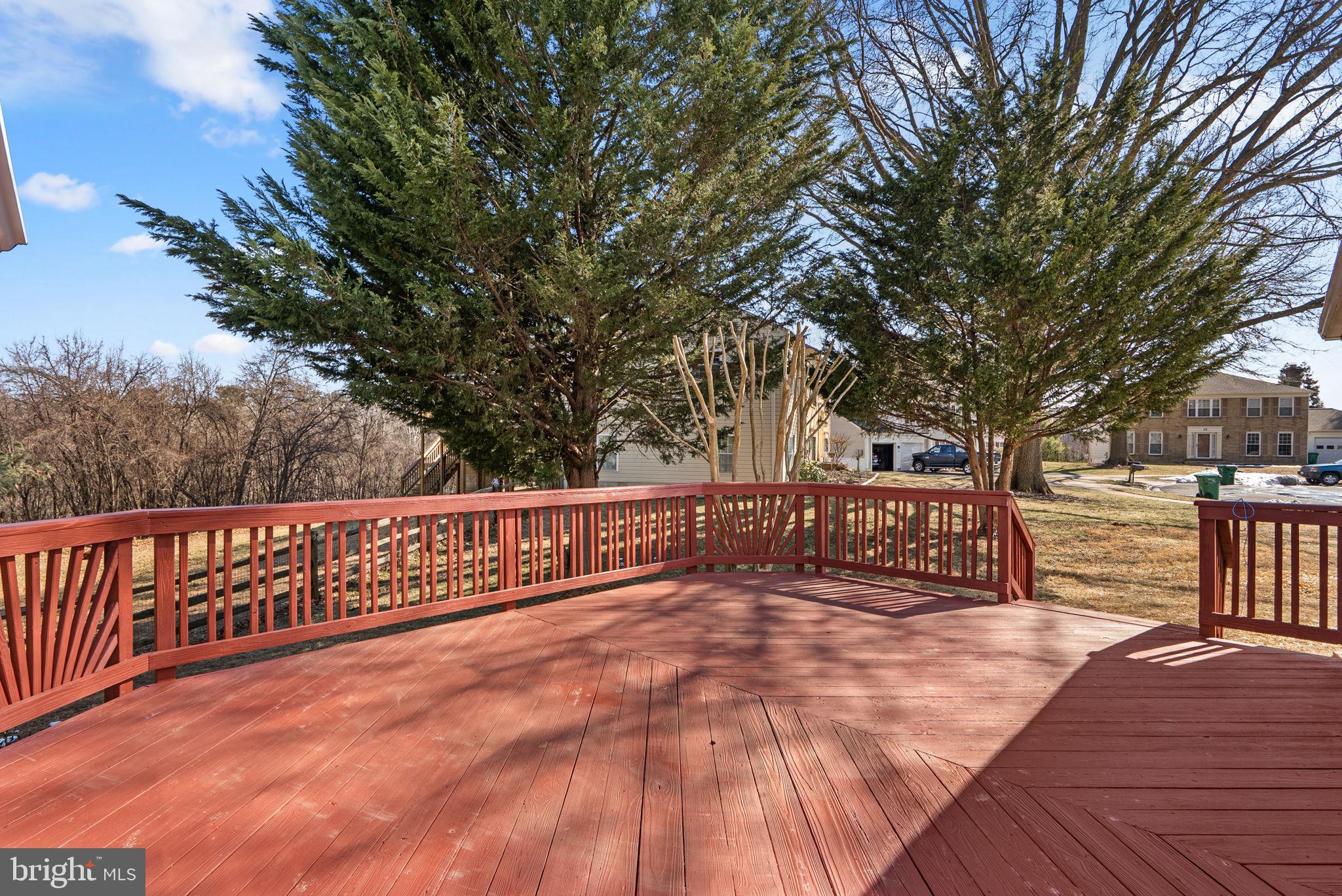 8 Seville Way Gaithersburg, MD 20878 - Photo 29 of 45 a view of outdoor space with deck and tree