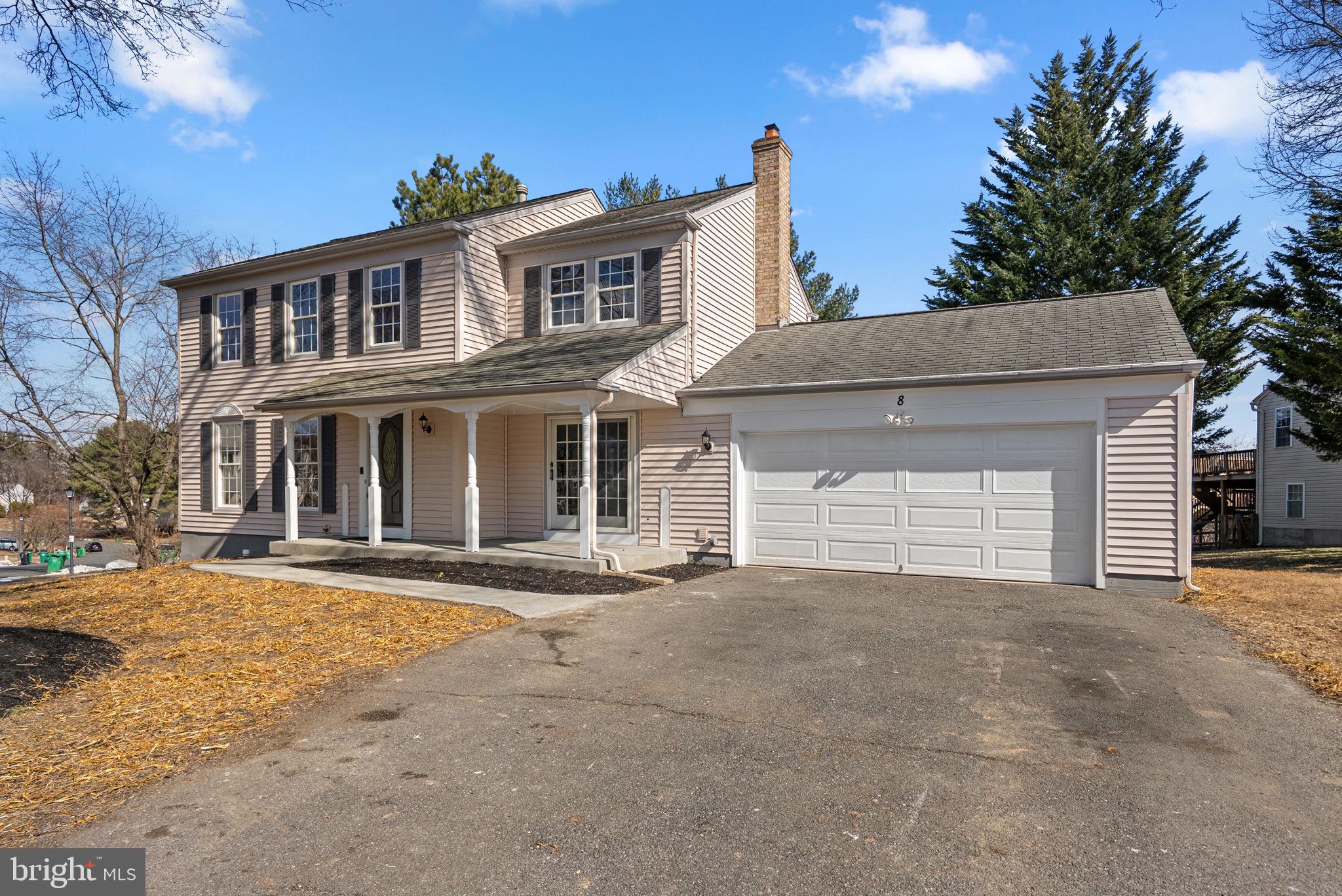8 Seville Way Gaithersburg, MD 20878 - Photo 3 of 45 a front view of a house with a yard and garage