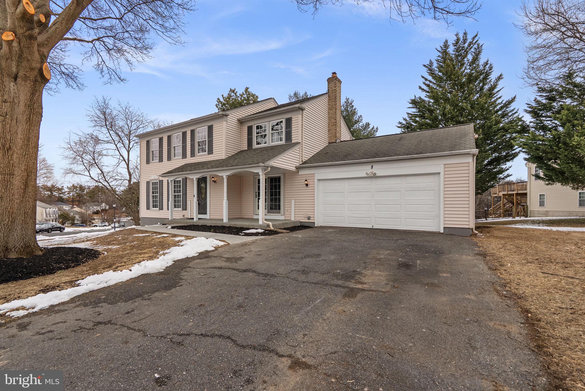 8 Seville Way Gaithersburg, MD 20878 - Photo 37 of 45 a view of a house with a yard and garage