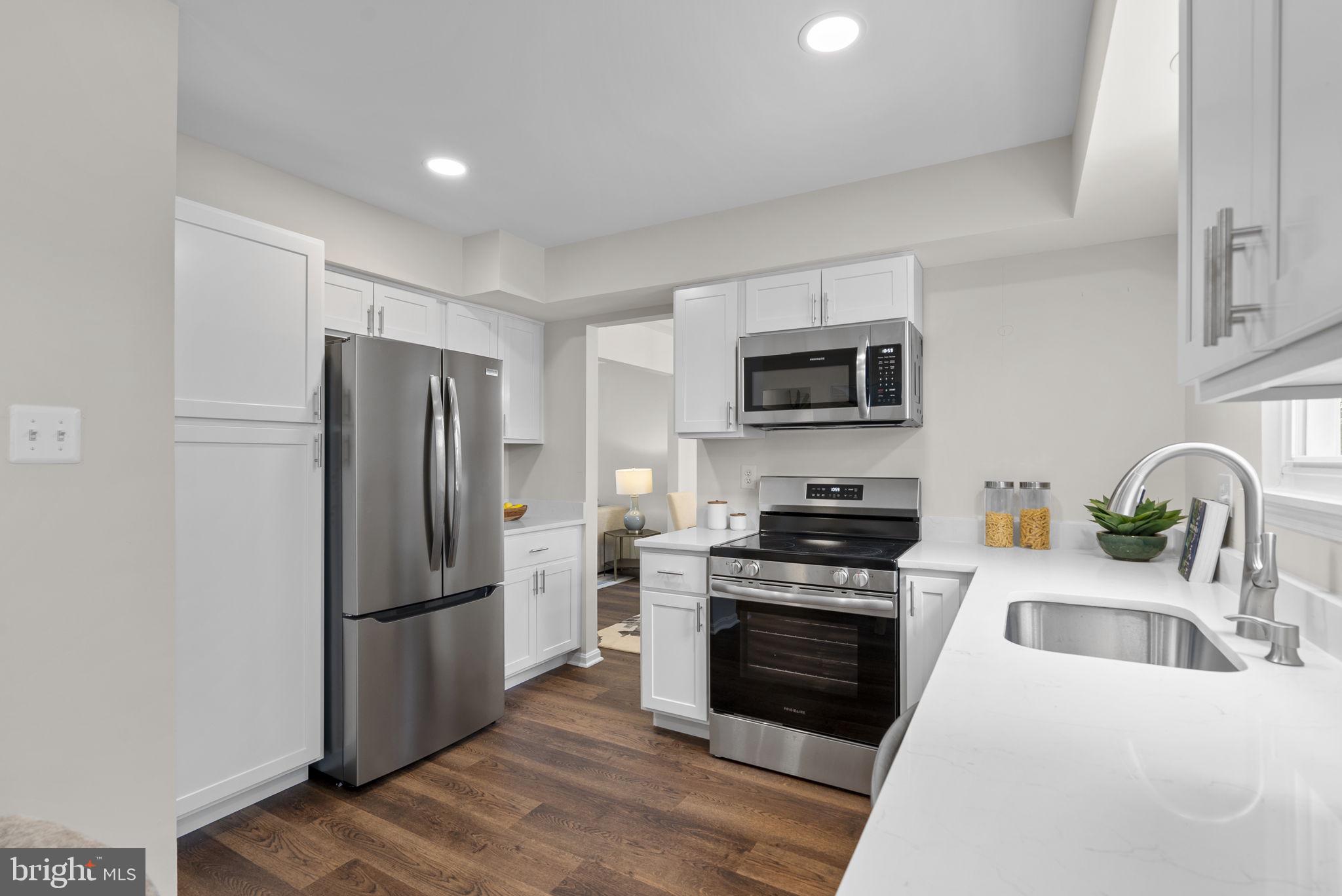8 Seville Way Gaithersburg, MD 20878 - Photo 40 of 45 a kitchen with a refrigerator stove and microwave