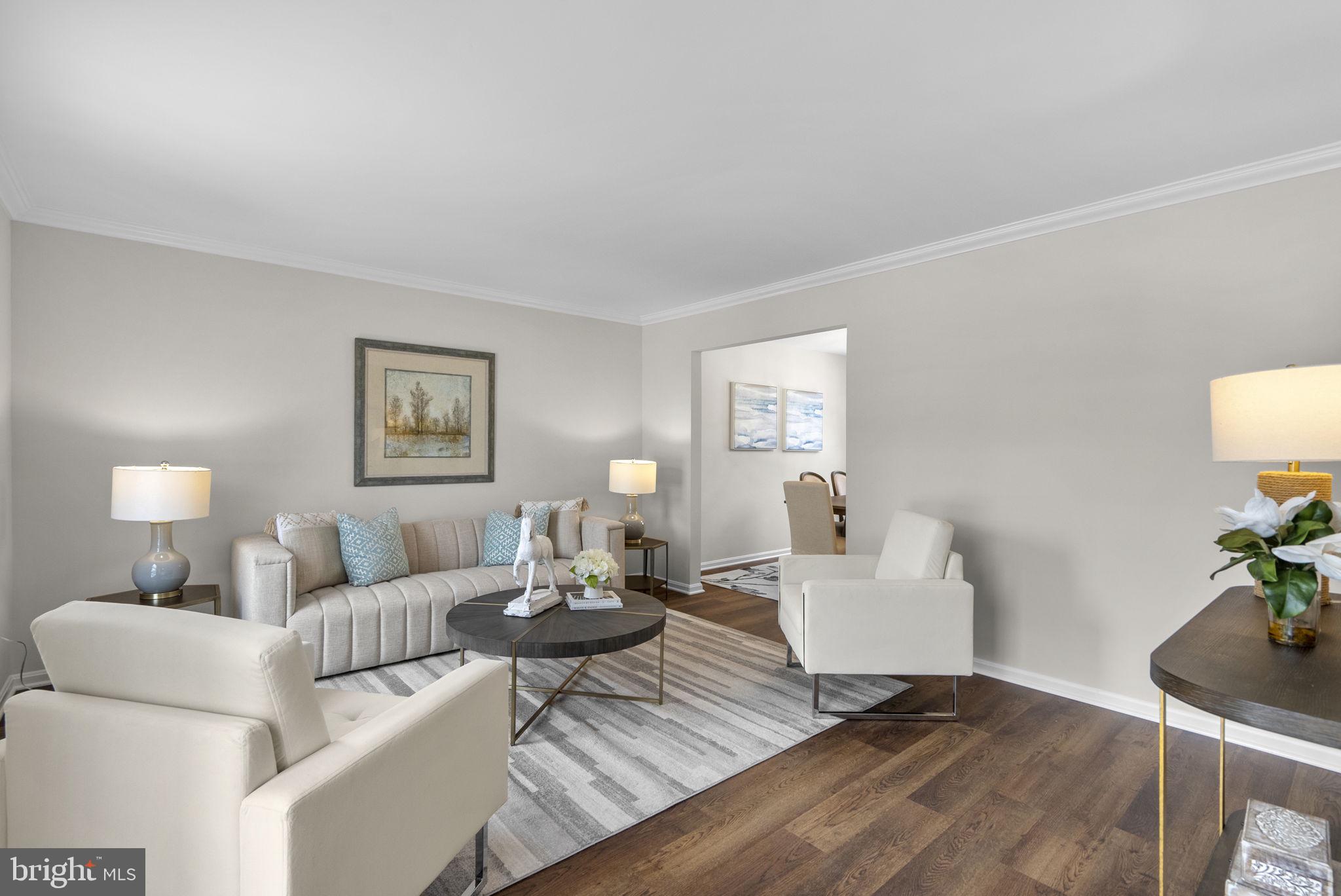 8 Seville Way Gaithersburg, MD 20878 - Photo 4 of 45 a living room with furniture and a wooden floor