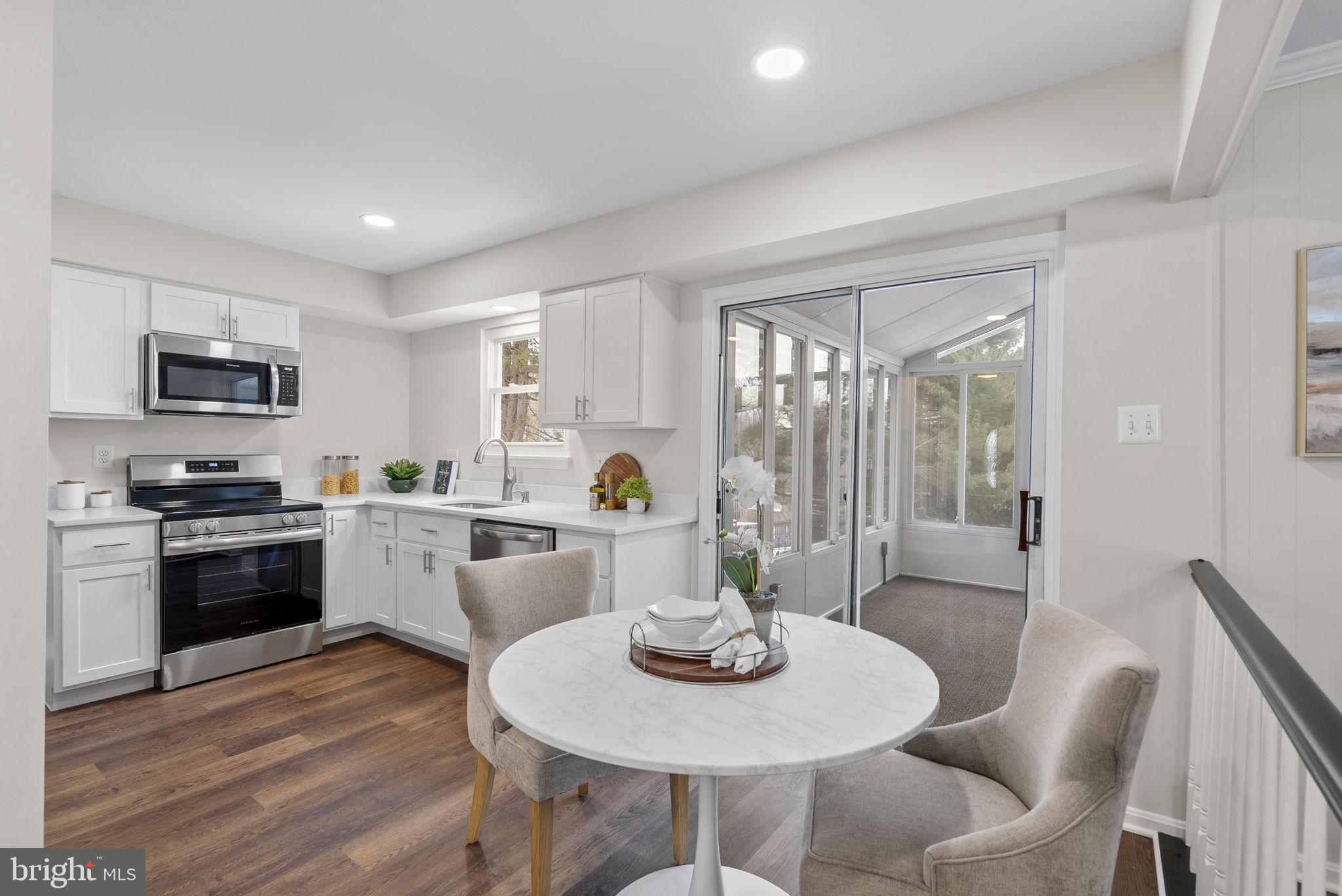 8 Seville Way Gaithersburg, MD 20878 - Photo 41 of 45 a kitchen with sink dining table and chairs