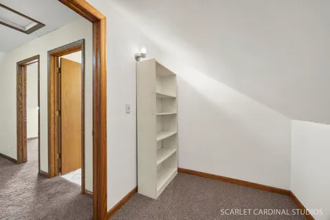 a view of an empty room and fire place