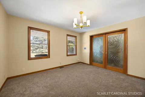 a view of an empty room with a window