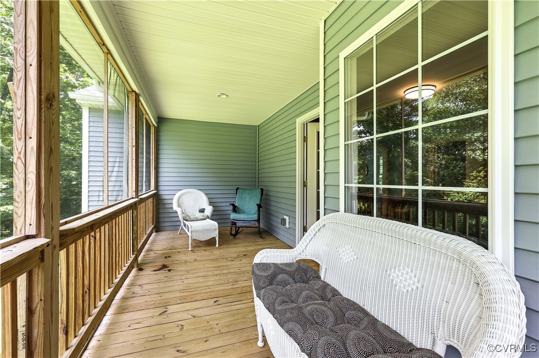 4290 Three Chopt Road Gum Spring, VA 23065 - Photo 11 of 32 a balcony with couch and wooden floor