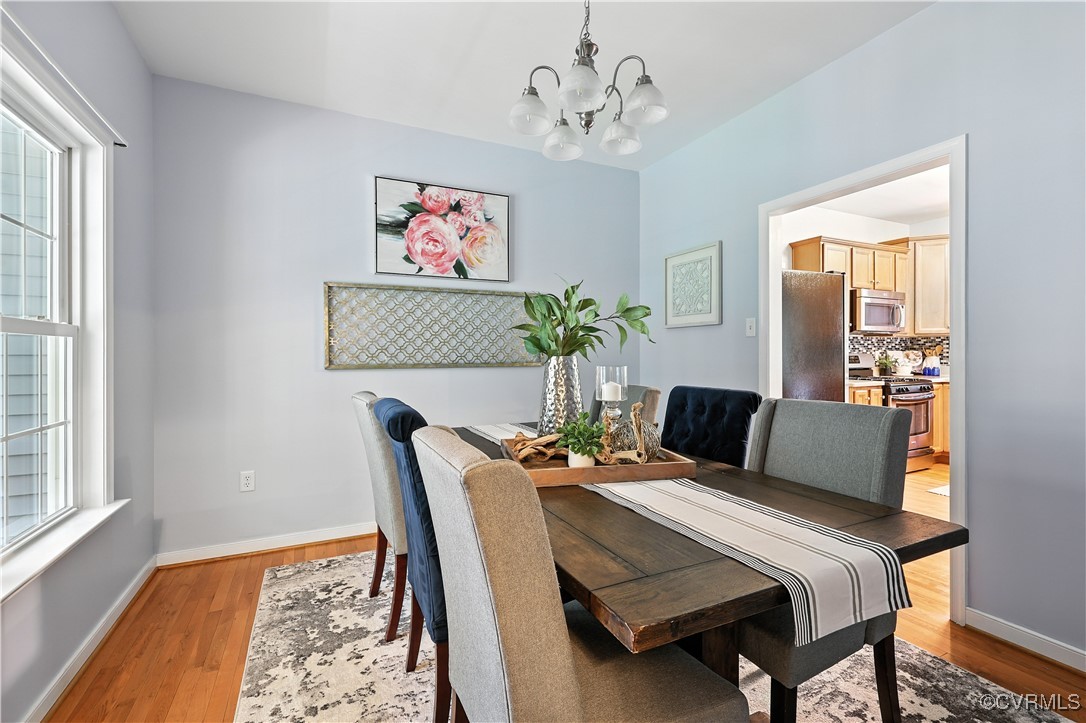 4290 Three Chopt Road Gum Spring, VA 23065 - Photo 19 of 32 a bedroom with a bed and wooden floor