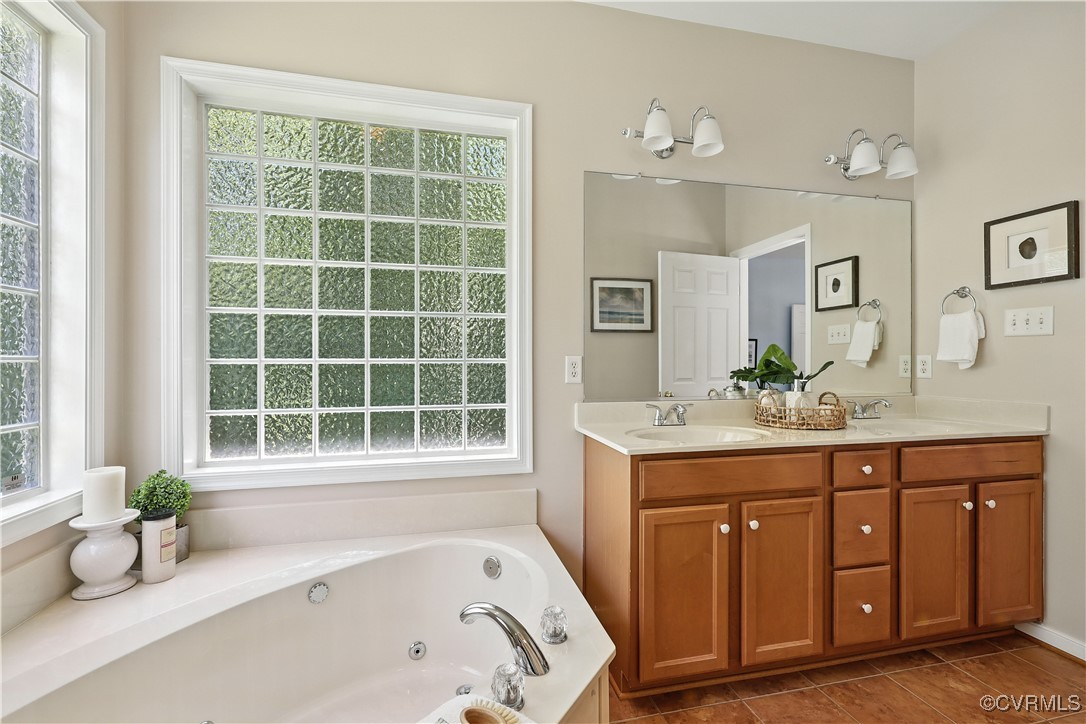 4290 Three Chopt Road Gum Spring, VA 23065 - Photo 22 of 32 a bathroom with a tub sink and a window