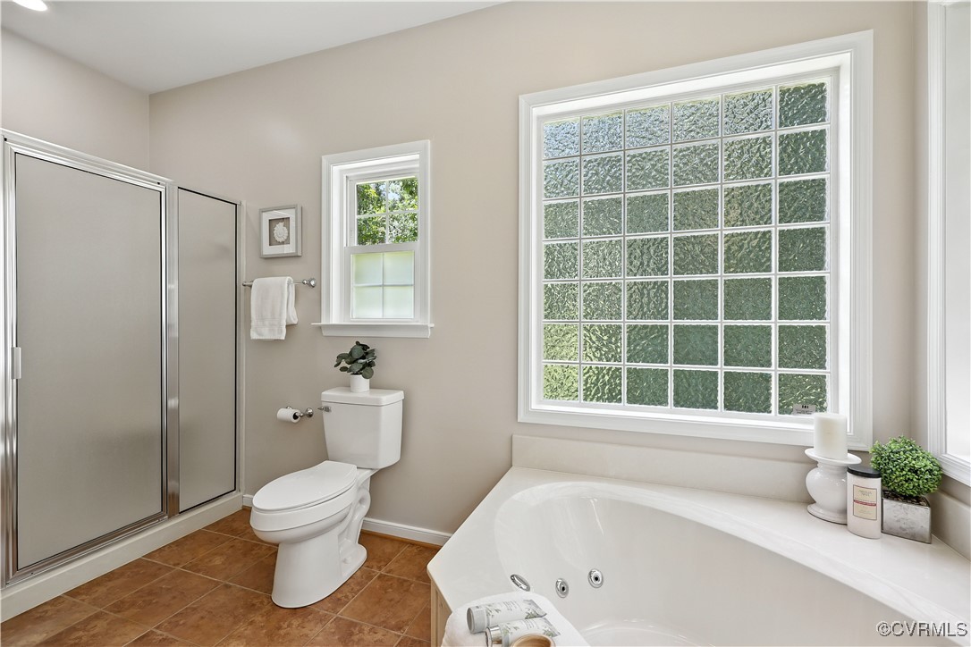 4290 Three Chopt Road Gum Spring, VA 23065 - Photo 23 of 32 a bathroom with a bathtub and a toilet