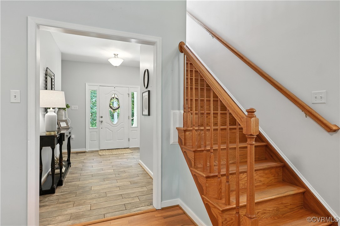 4290 Three Chopt Road Gum Spring, VA 23065 - Photo 27 of 32 a view of a hallway with wooden floor and staircase