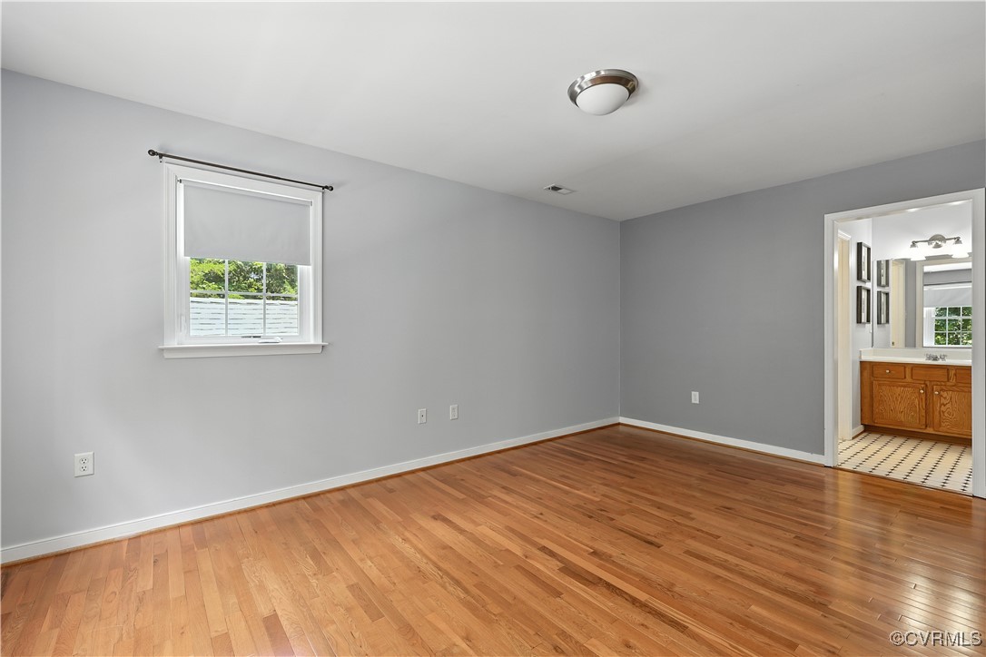 4290 Three Chopt Road Gum Spring, VA 23065 - Photo 32 of 32 an empty room with wooden floor and windows