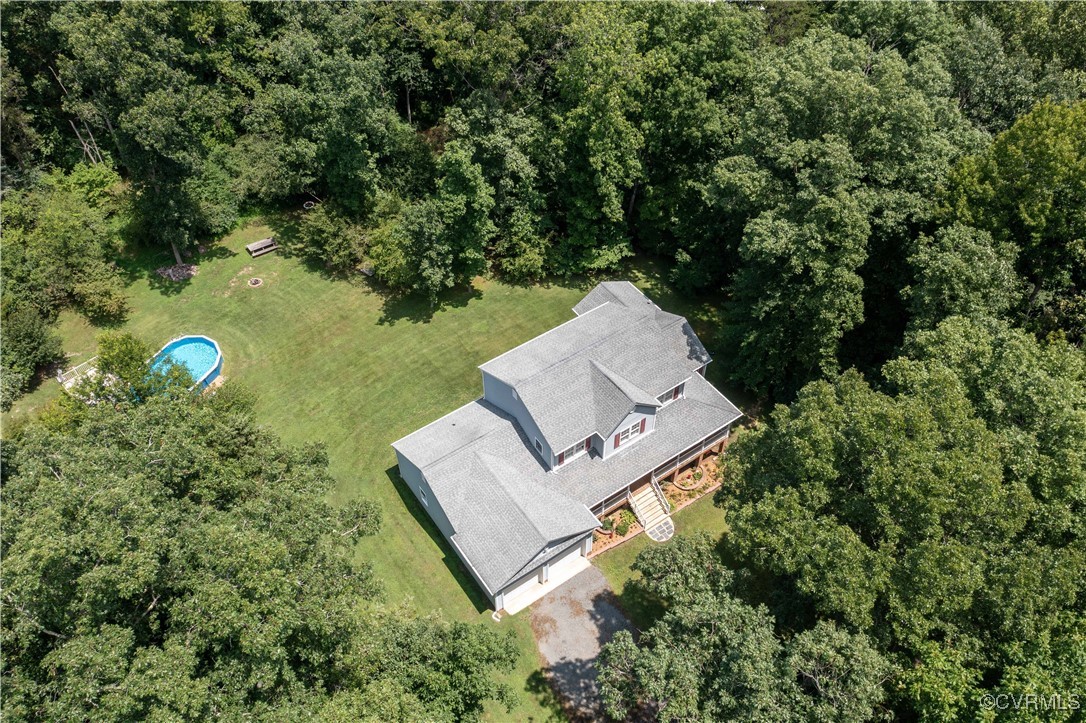 4290 Three Chopt Road Gum Spring, VA 23065 - Photo 5 of 32 a view of a bench in a garden