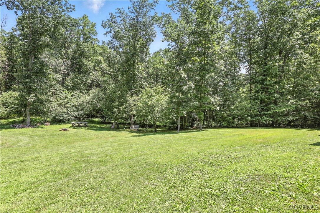 4290 Three Chopt Road Gum Spring, VA 23065 - Photo 7 of 32 a view of a field with an trees