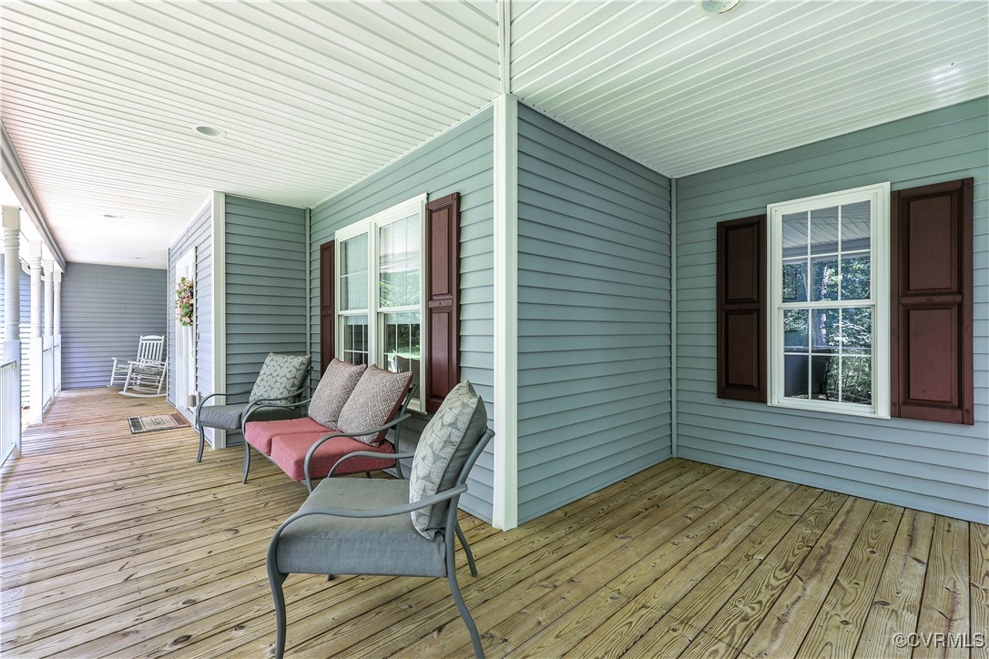 4290 Three Chopt Road Gum Spring, VA 23065 - Photo 10 of 32 a view of a patio with couches chairs and wooden floor