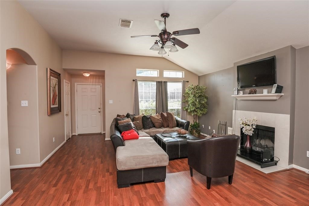 18446 South Wimbledon Drive Katy, TX 77449 - Photo 4 of 24 a living room with furniture fireplace and flat screen tv