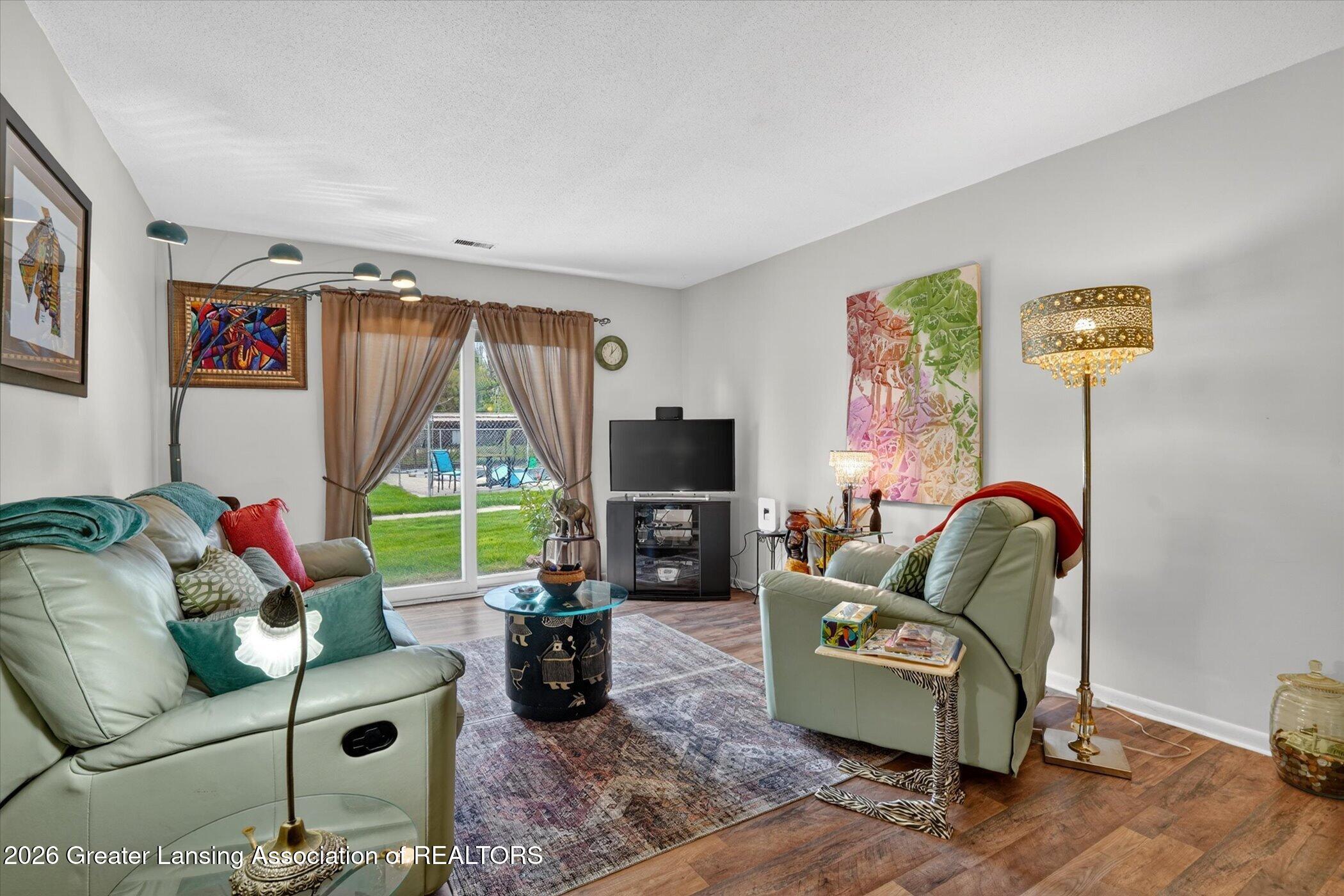 4809 Gull Road, Unit 23 Lansing, MI 48917 - Photo 9 of 26 09-4809-Gull-Rd-apt-23-WindowStill-Real-