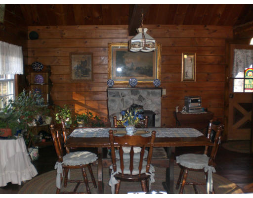 96 Rice Corner Road Brookfield, MA 01506 - Photo 12 of 23 a view of a dining room with furniture and wooden floor