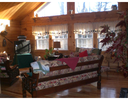 96 Rice Corner Road Brookfield, MA 01506 - Photo 16 of 23 a view of a dining room with furniture and chandelier