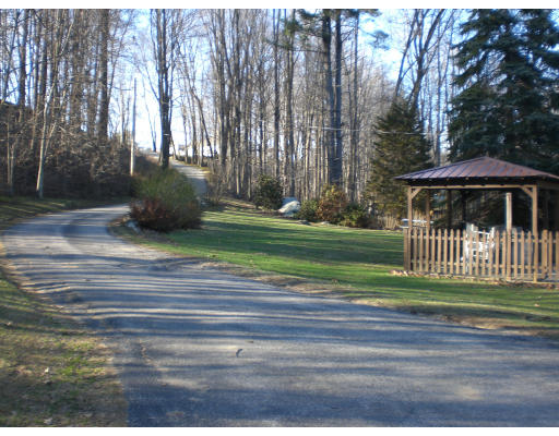 96 Rice Corner Road Brookfield, MA 01506 - Photo 4 of 23 a view of a deck with a big yard