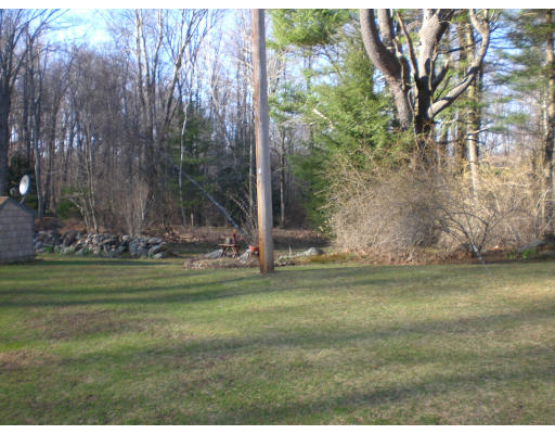 96 Rice Corner Road Brookfield, MA 01506 - Photo 6 of 23 a backyard of a house with lots of green space