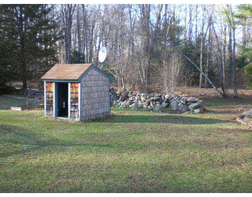 96 Rice Corner Road Brookfield, MA 01506 - Photo 7 of 23 a front view of a house with garden