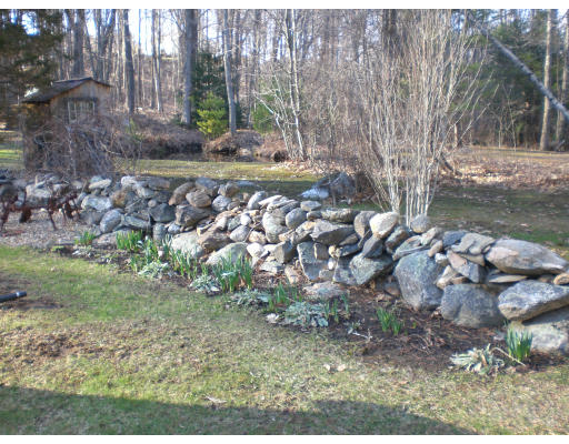 96 Rice Corner Road Brookfield, MA 01506 - Photo 8 of 23 a backyard of a house with lots of green space