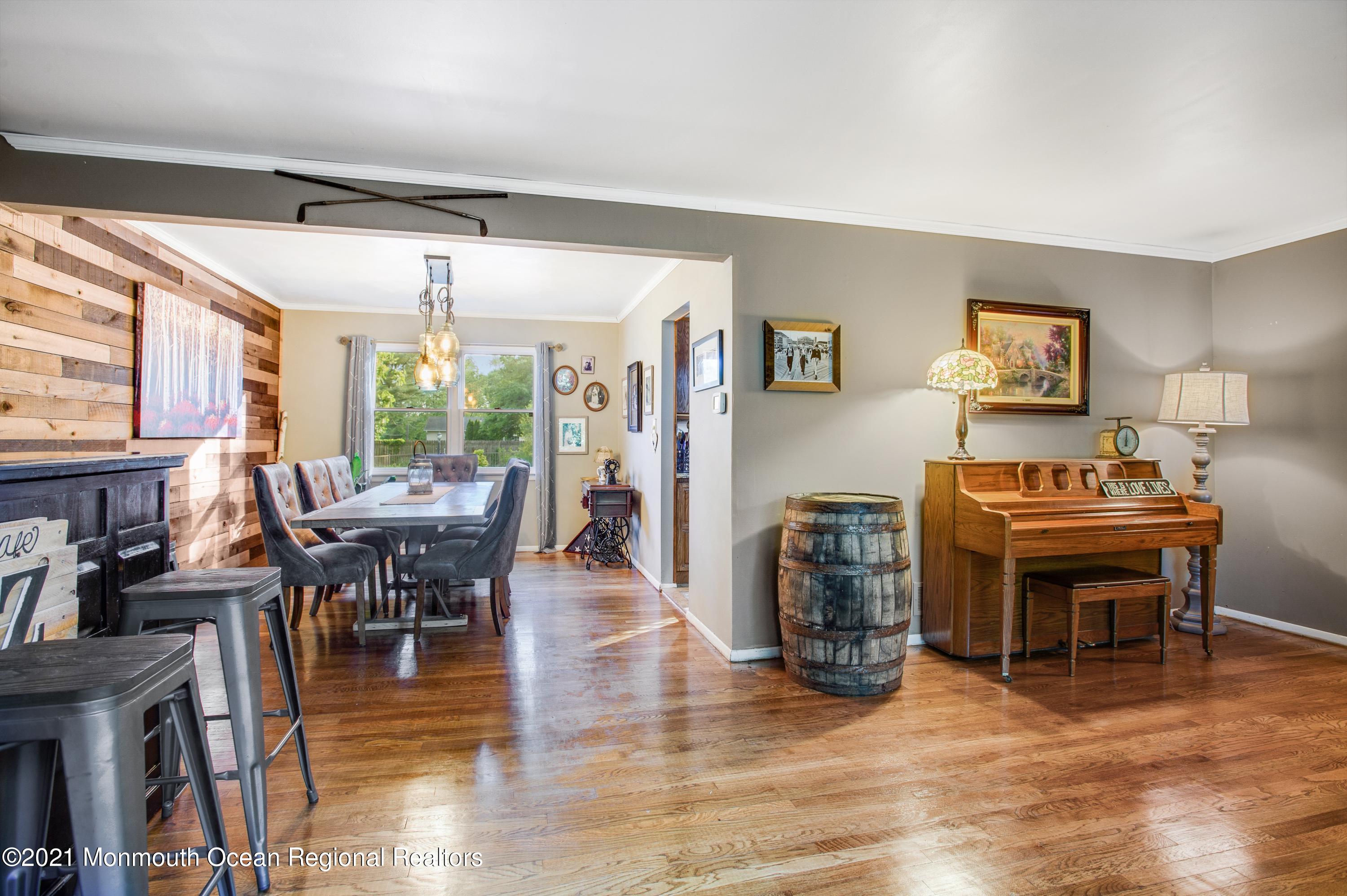 131 Bar Harbor Road Freehold, NJ 07728 - Photo 7 of 31 a view of a dining room with furniture window and wooden floor