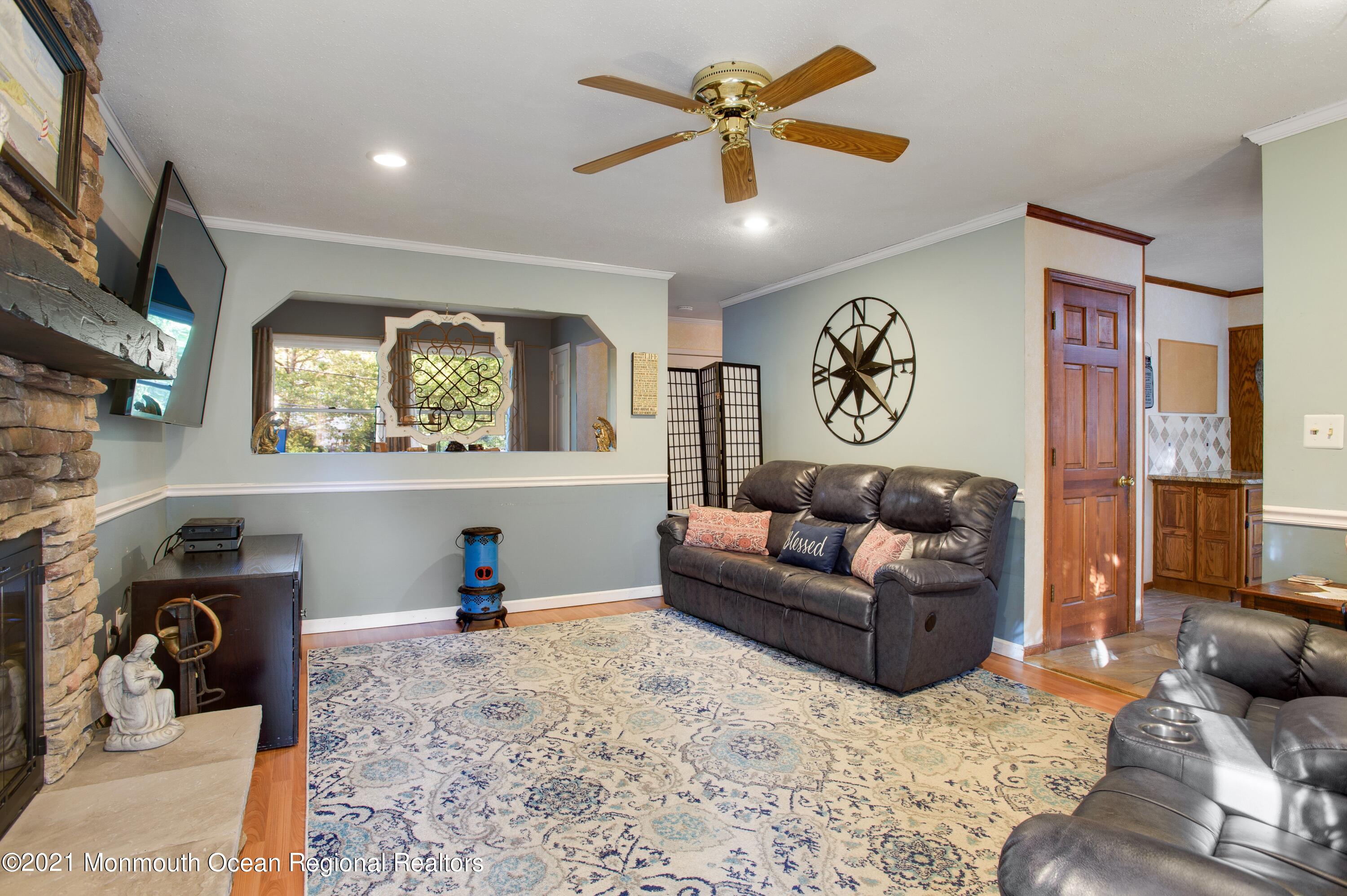 131 Bar Harbor Road Freehold, NJ 07728 - Photo 10 of 31 a living room with furniture and a flat screen tv