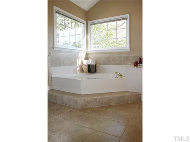 8508 Wheeling Drive Raleigh, NC 27615 - Photo 5 of 12 Another view of the brand new tile flooring and large garden tub. Lots of natural light overlooking your backyard.