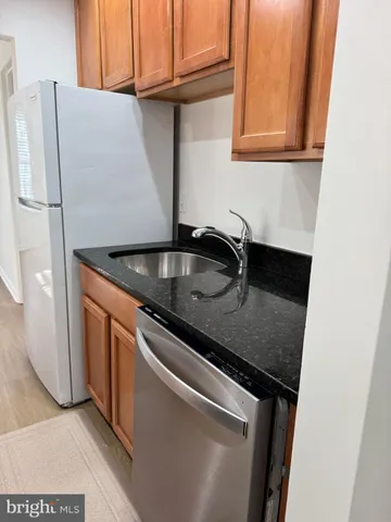 a close view of a sink and dishwasher