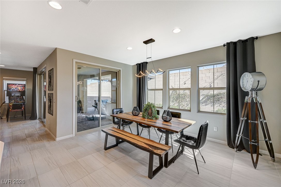 12898 Slipknot Street Las Vegas, NV 89141 - Photo 16 of 41 Dining area with large sliding doors