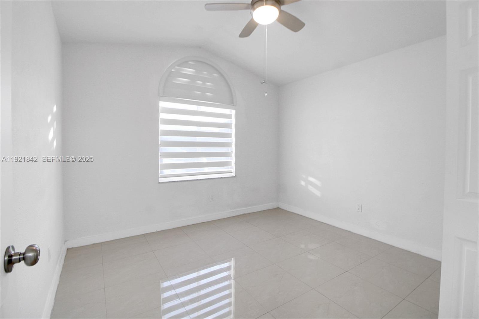 15251 Southwest 56th Terrace Miami, FL 33193 - Photo 12 of 29 an empty room with a window