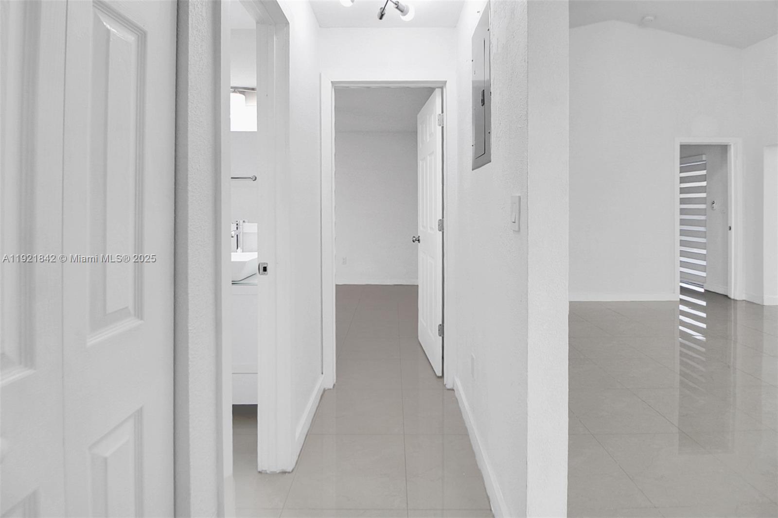 15251 Southwest 56th Terrace Miami, FL 33193 - Photo 14 of 29 a view of a bathroom from a hallway