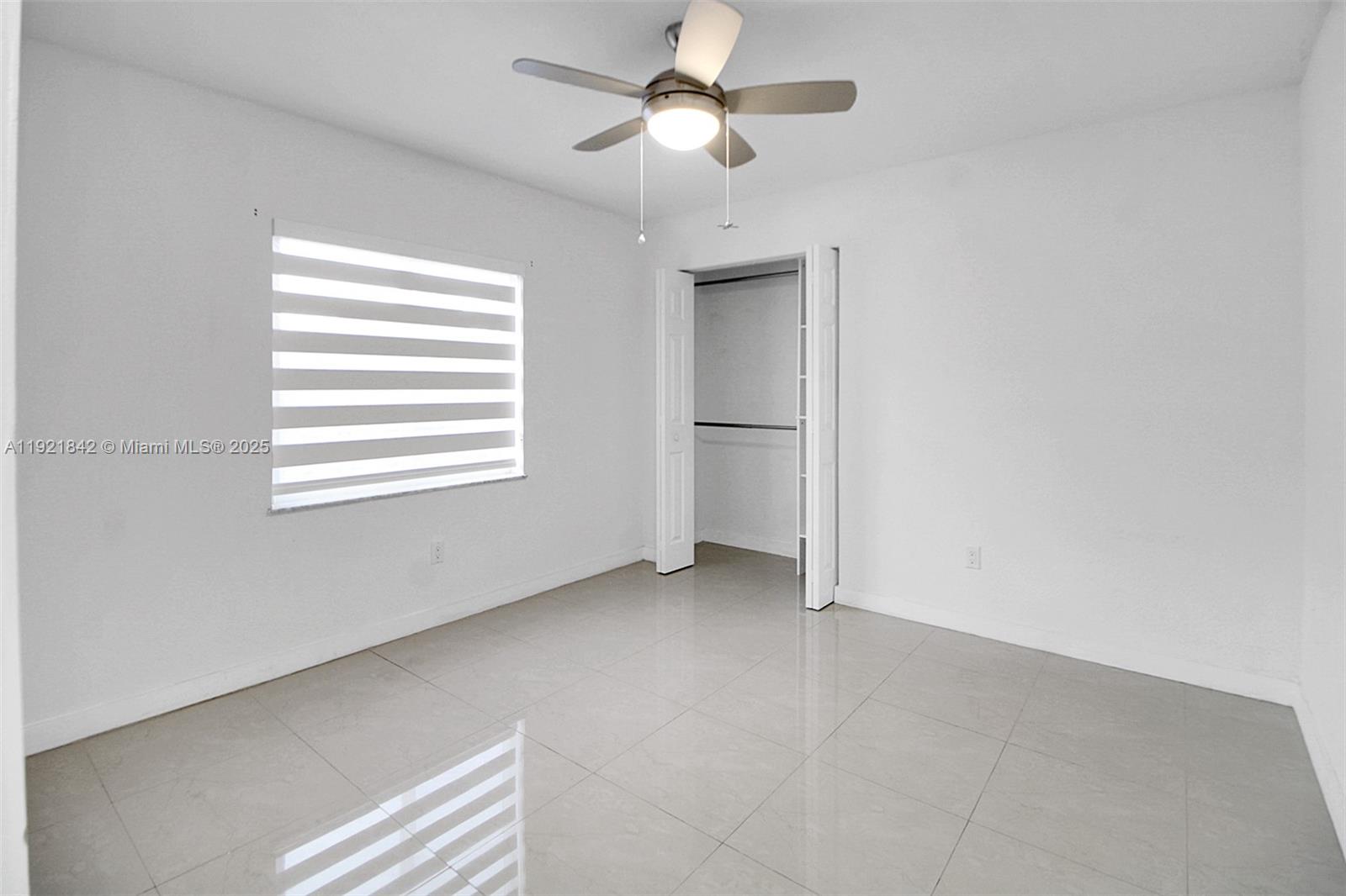 15251 Southwest 56th Terrace Miami, FL 33193 - Photo 16 of 29 a view of an empty room with a window