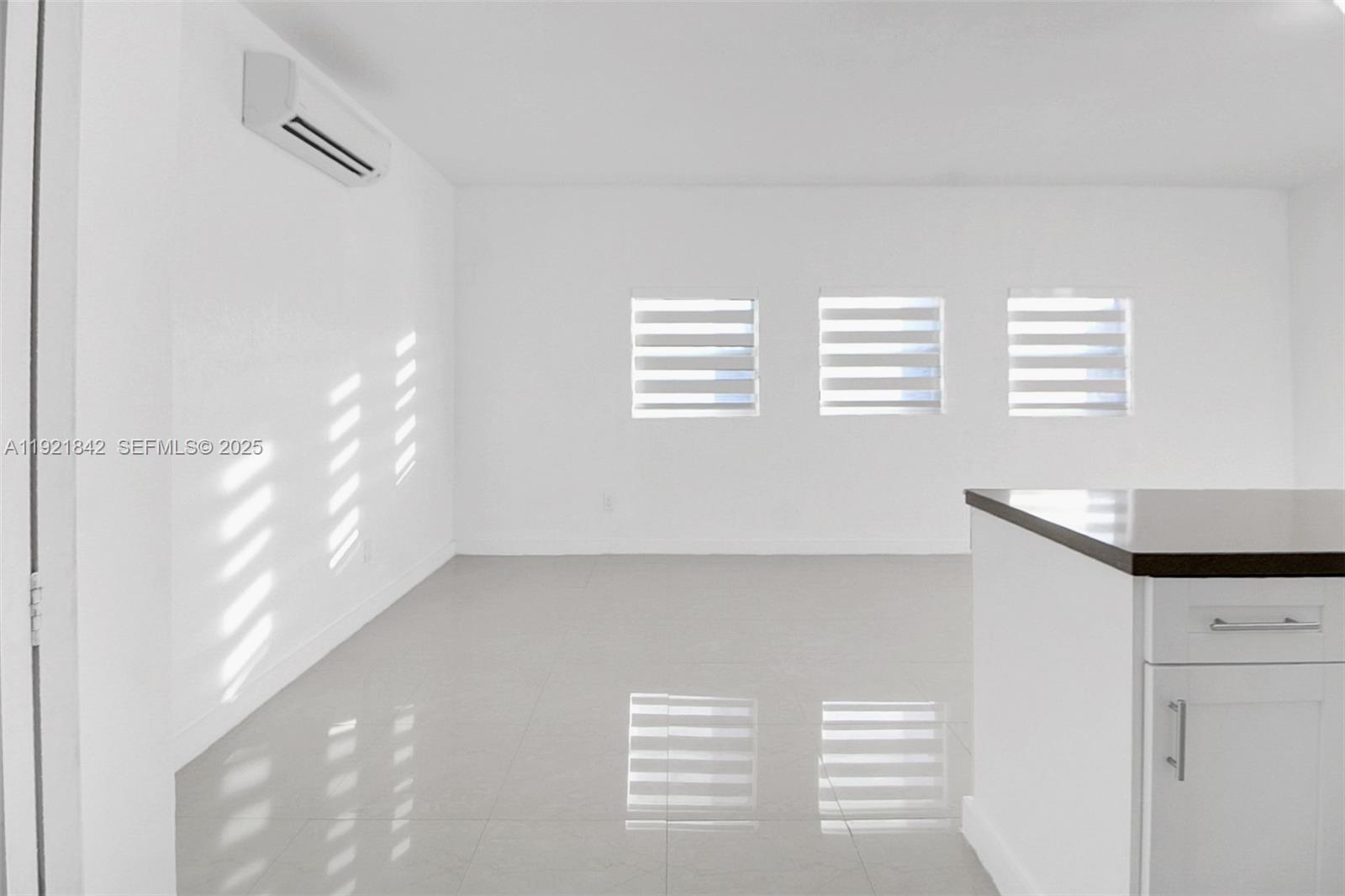 15251 Southwest 56th Terrace Miami, FL 33193 - Photo 18 of 29 a view of an empty room with windows