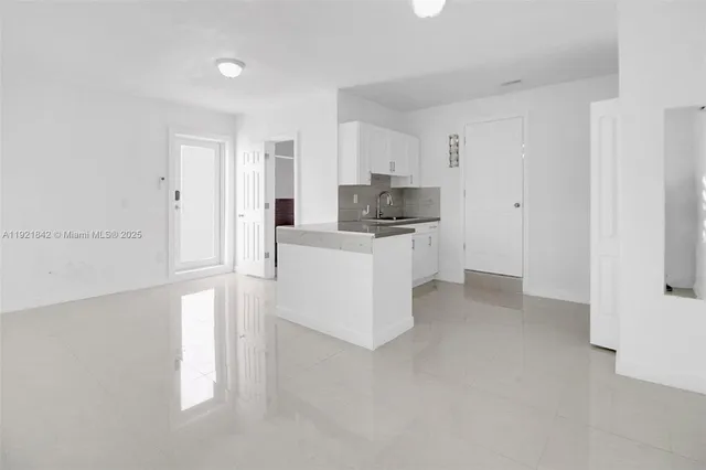 a view of a kitchen with a sink
