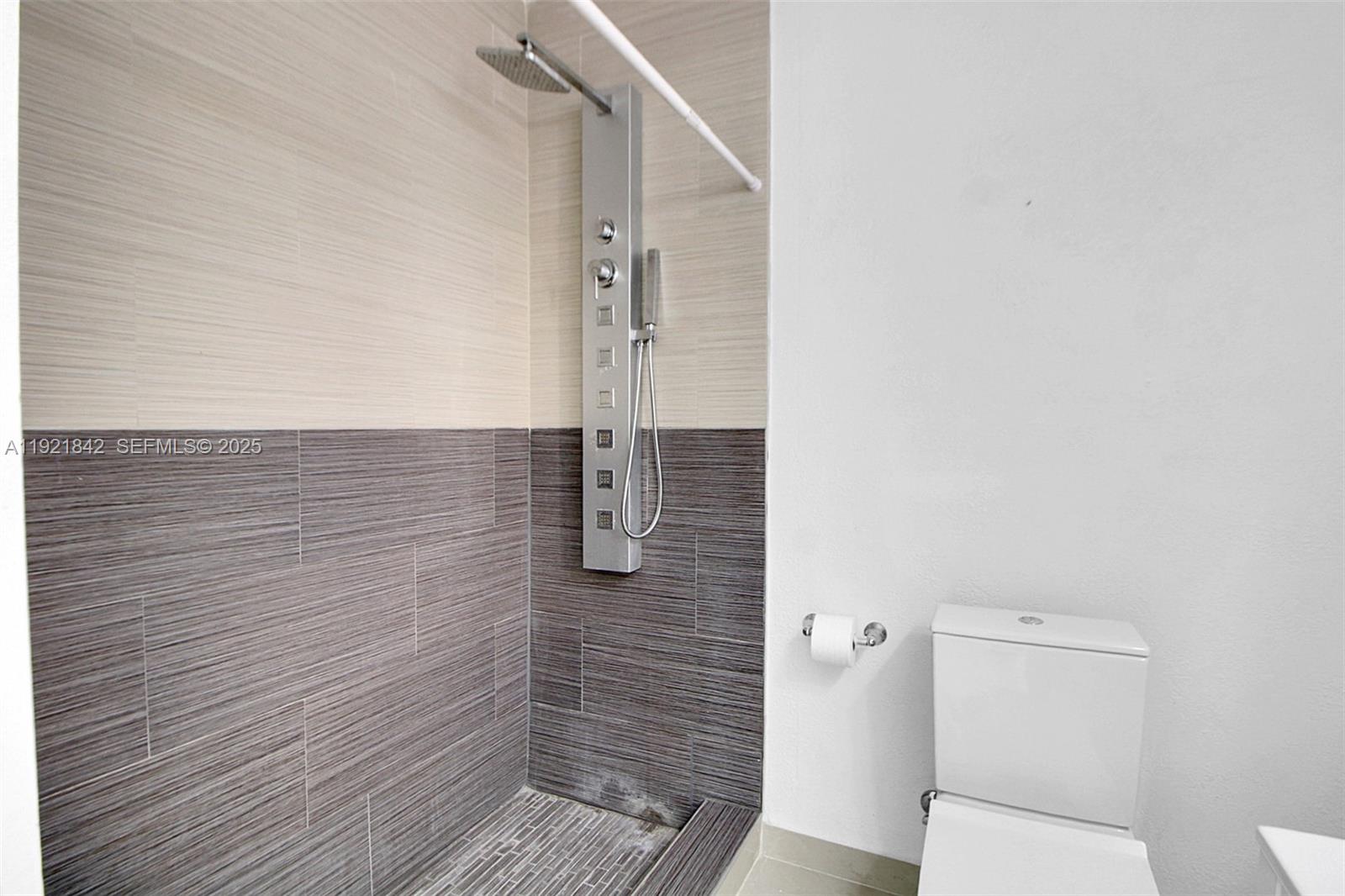 15251 Southwest 56th Terrace Miami, FL 33193 - Photo 21 of 29 a bathroom with a toilet and a shower