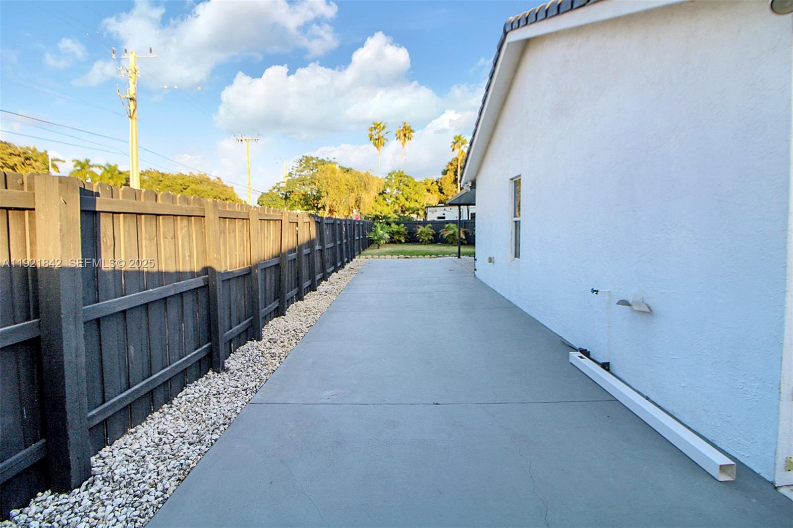 15251 Southwest 56th Terrace Miami, FL 33193 - Photo 26 of 29 a view of a balcony with wooden fence