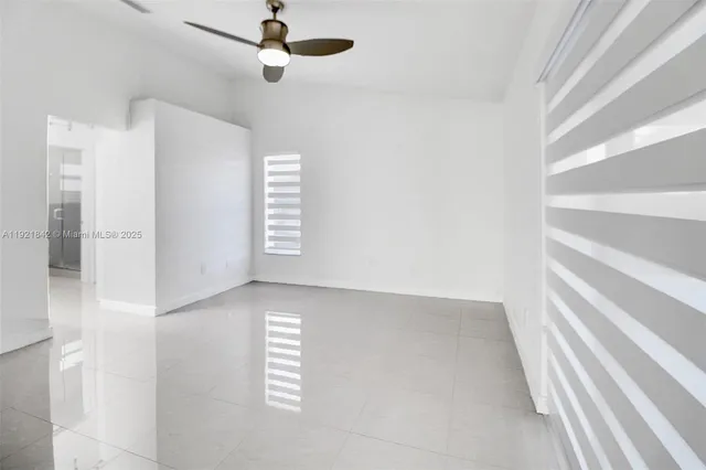 a view of empty room with windows