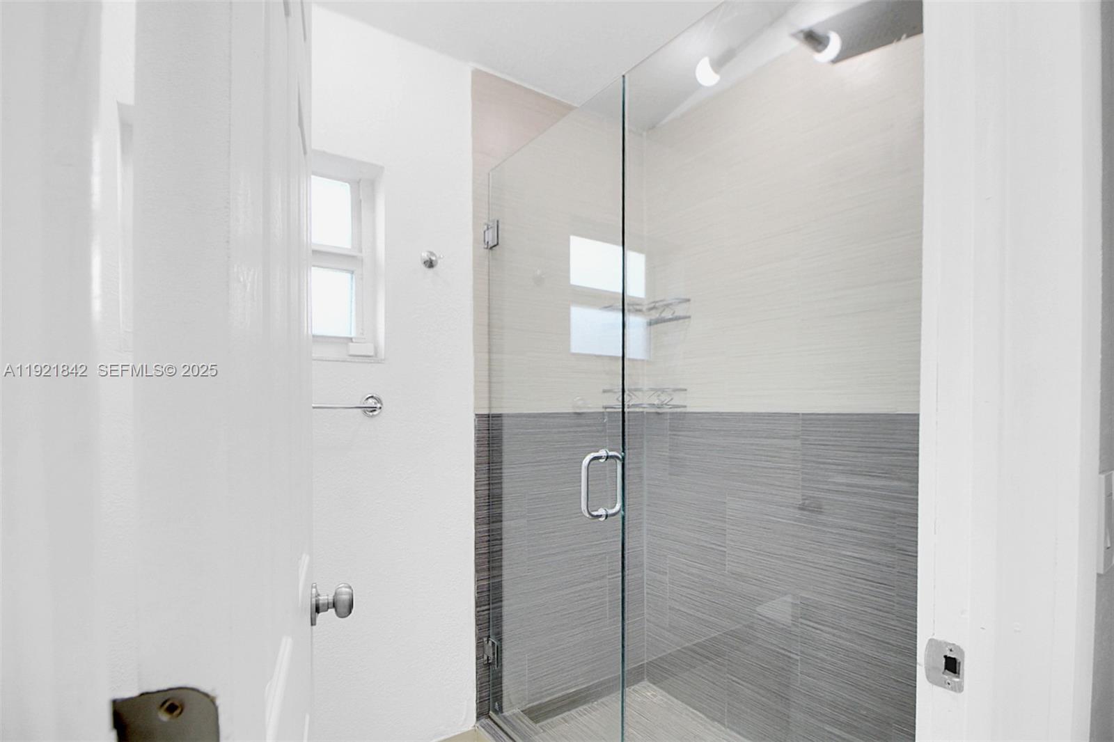 15251 Southwest 56th Terrace Miami, FL 33193 - Photo 10 of 29 a bathroom with a shower