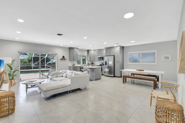 a living room with furniture and a table