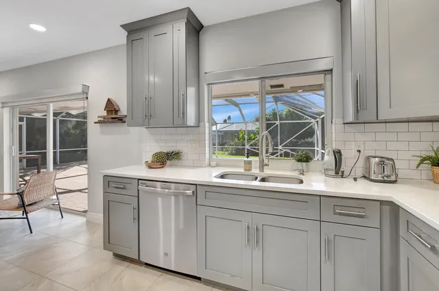 a kitchen with a sink and cabinets