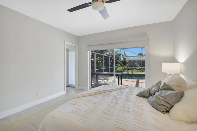 a bed room with a bed and a window