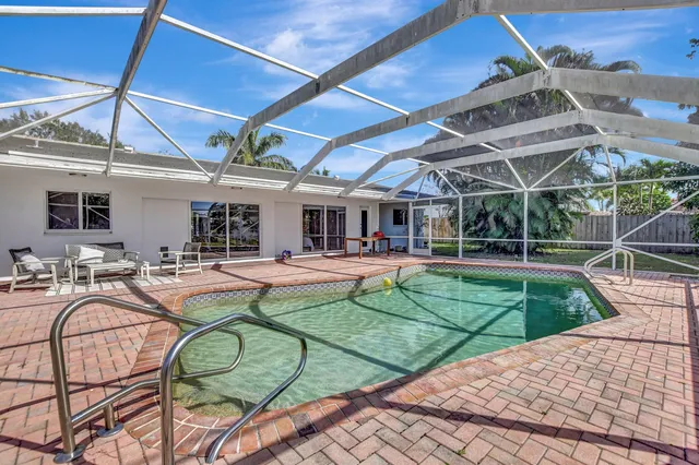 a view of a swimming pool with a patio