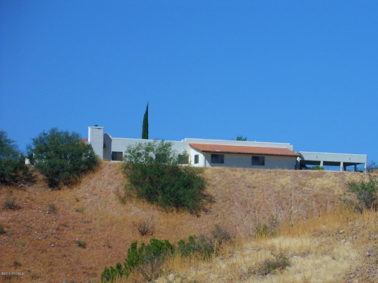 293 Cuenta Court Rio Rico, AZ 85648 - Photo 23 of 25 a backyard of a house with lots of green space