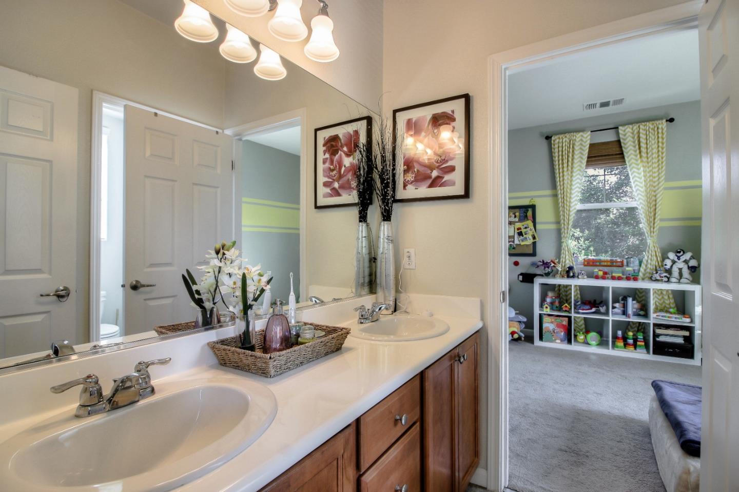 692 Gale Drive Campbell, CA 95008 - Photo 17 of 23 a bathroom with a double vanity sink and a mirror