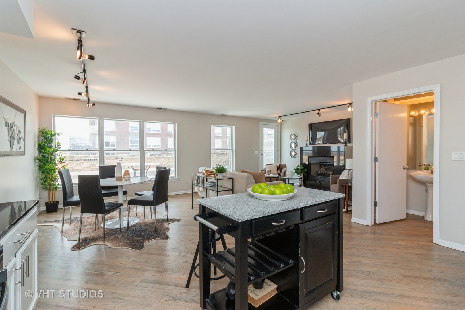 1830 Ridge Avenue, Unit 5C Evanston, IL 60201 - Photo 3 of 11 a view of a dining room with furniture and wooden floor