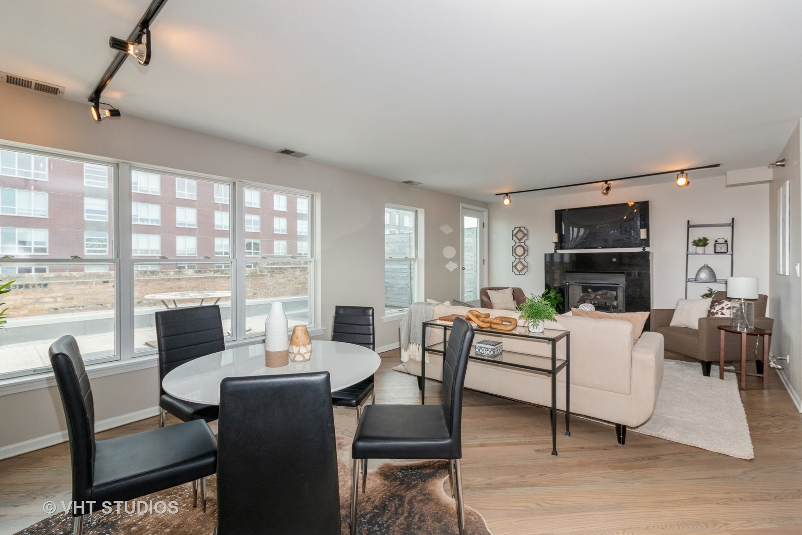 1830 Ridge Avenue, Unit 5C Evanston, IL 60201 - Photo 5 of 11 a living room with fireplace furniture and a large window